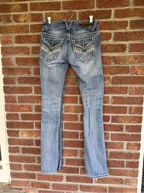 vigoss jeans.  size 1.  1x33.  long.  nice embellishments.